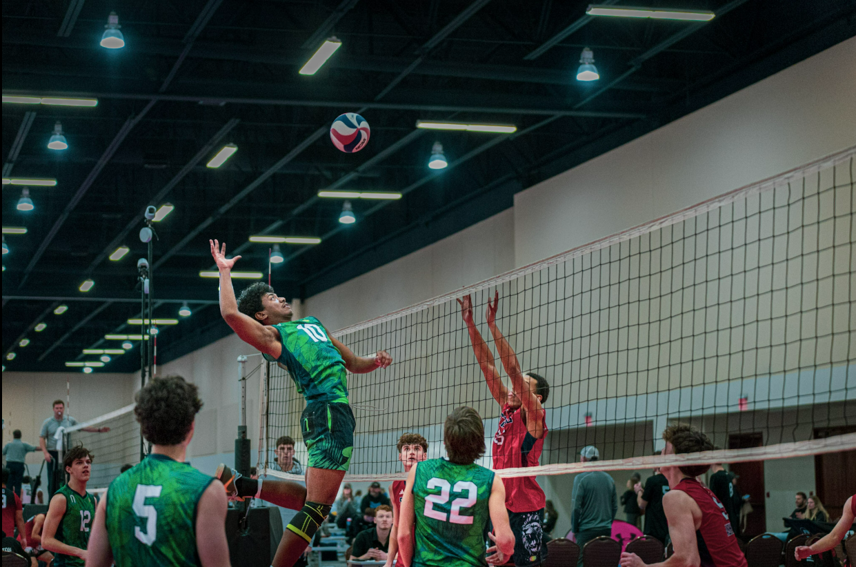 Palmetto Shore player attacking at the net during a match